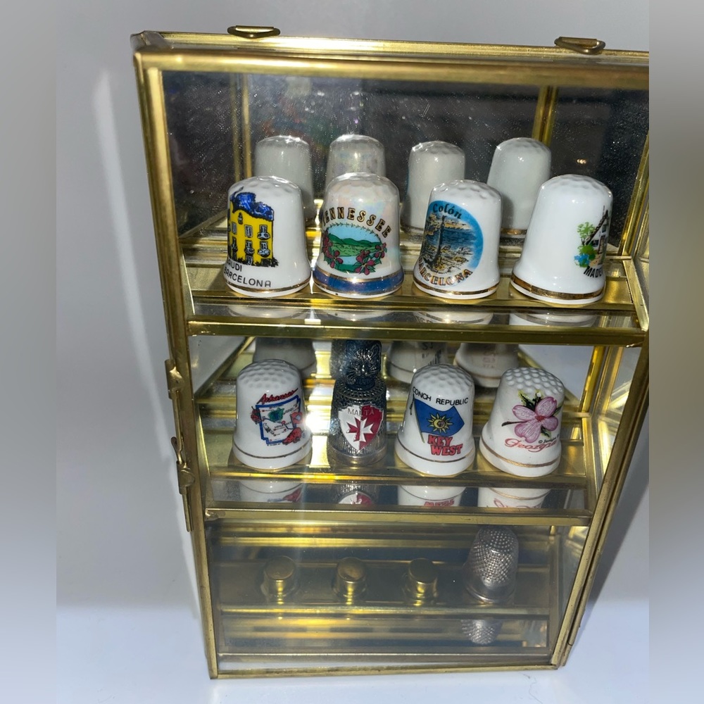 Brass display thimble curio cabinet